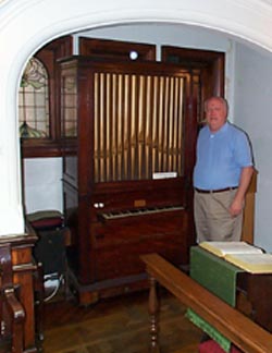 Larry by the Charles Wesley organ at the Wesley Chapel in London.